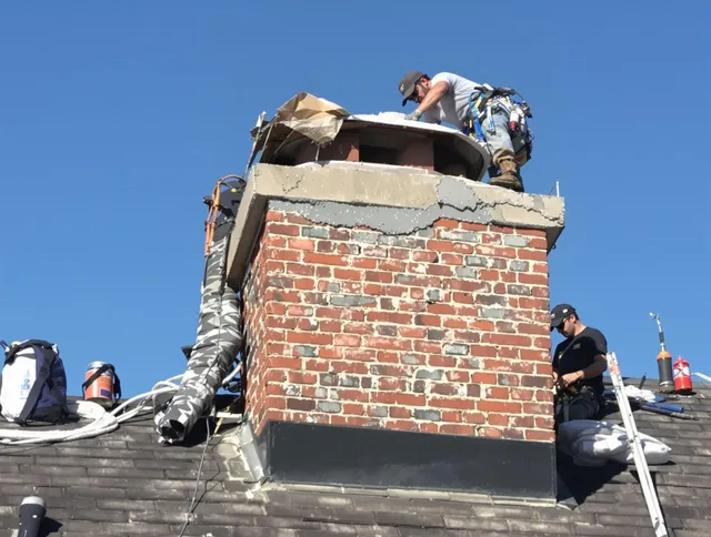 Stratford Chimney Sweep installing a custom chimney crown in Stratford, CT