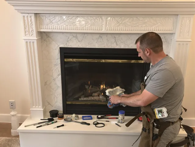 Stratford Chimney Sweep performing fireplace maintenance in Stratford, CT