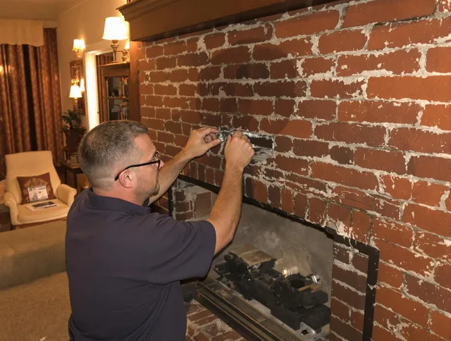 Stratford Chimney Sweep expert fixing a fireplace in Stratford, CT